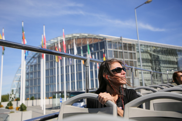 Woman exploring Luxembourg City on a double decker bus
