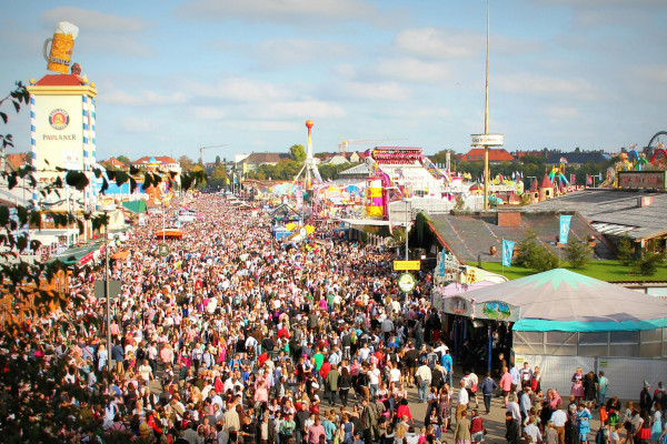 Crowds, colourful fairground attractions and beer tents at Munich Oktoberfest
