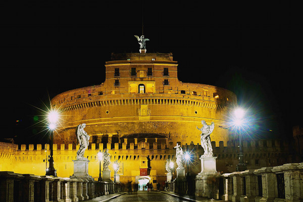 Night view of Castel Sant'Angelo from the Bridge of Angels.