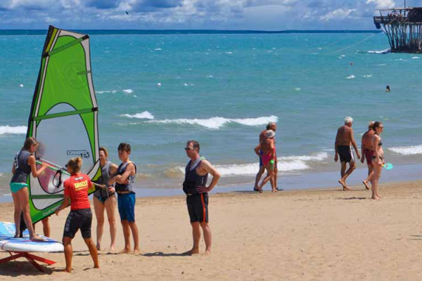 Practice with a simulator on the beach.