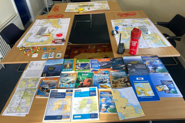 A well-equipped and interactive classroom setting hosting an engaging RYA Powerboat Course, where participants are immersed in theoretical sessions, learning about navigation, safety regulations, and advanced powerboat techniques.