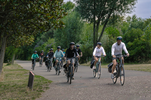 inaeri ebike tour group rides in a park in paris