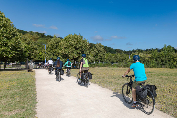 inaeri ebike tour group rides their bikes on park of saint-cloud in paris on the way to versailles