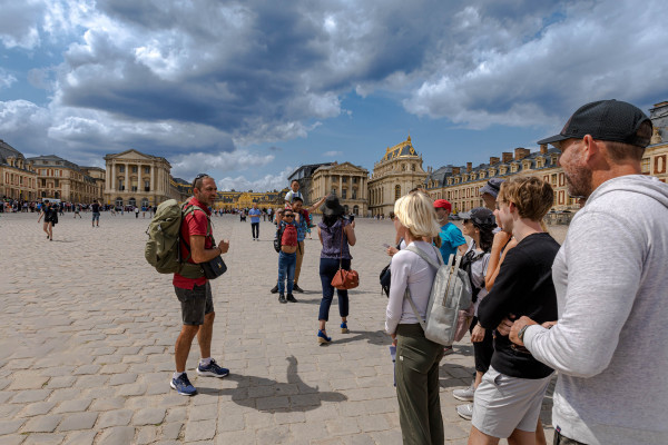 inaeri electric bike tour group are visiting versailles palace in paris area