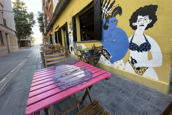 The dynamic contrast between historic homes and modern street art in the heart of El Cabanyal.