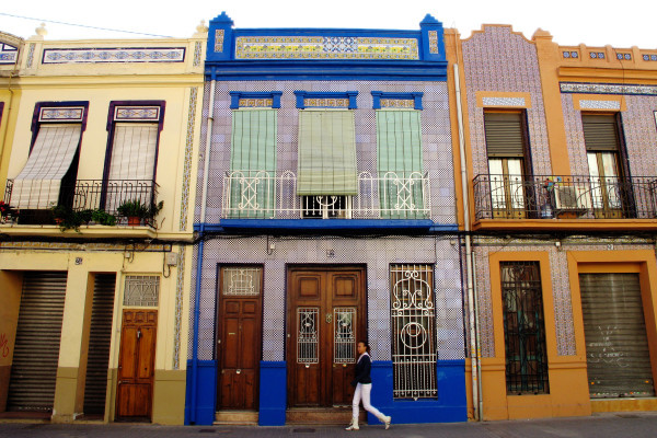 Restored facades with intricate ceramic patterns, showcasing El Cabanyal’s unique craftsmanship.