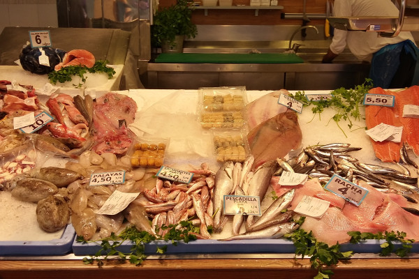 A bustling local market in El Cabanyal offering fresh seafood and traditional Valencian produce.