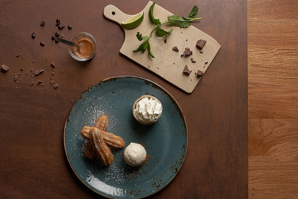 Churros with chocolate sauce and ice cream, Qosqo