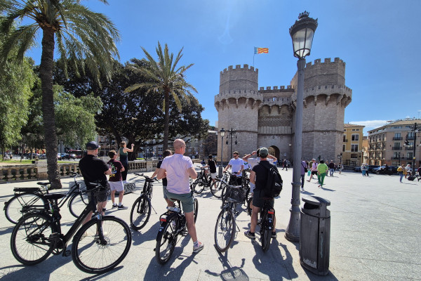 Capture medieval charm with a photo stop at Serranos Towers during your bike tour