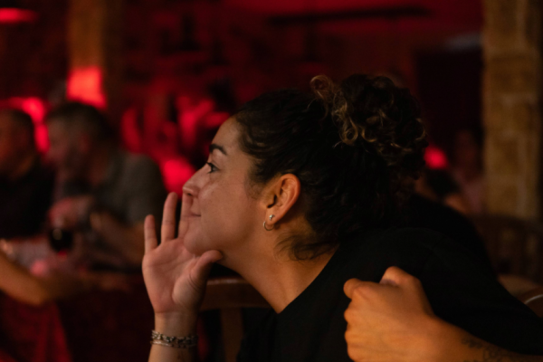A unique Lisbon night out: traditional Fado, heartfelt stories, and a cosy dinner setting.
