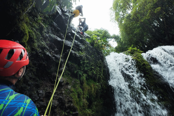 Starting the rappel with a photo on the top of the waterfall