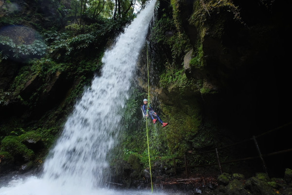 Rappel behind the waterfall