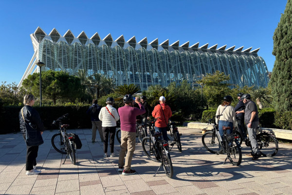 Bike tour group gathered near the futuristic architecture of Valencia’s City of Arts and Sciences