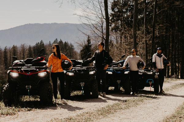 Group of riders enjoying a panoramic quad tour with professional guide. Perfect activity for couples, friends, and families looking to explore Slovenia in an adventurous way.