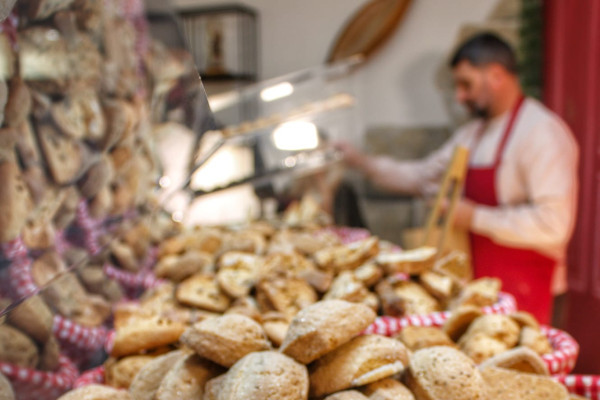 A producer of traditional Provençal biscuits - navettes - can be seen in the background of the shop.