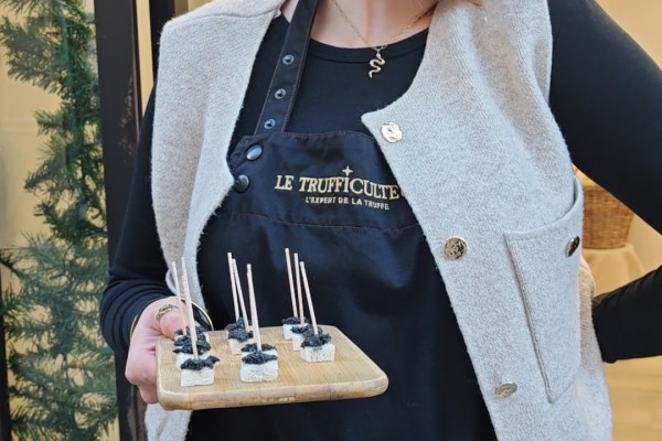 A vendor offering tastings of French and Provençal truffle-based products.