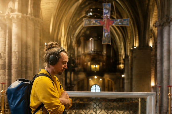 A visitor immersed in the story of Saint-Seurin Basilica, standing before the magnificent high altar.